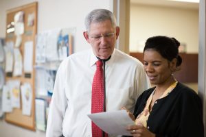 doctor and nurse viewing paperwork together