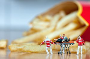 ER toy figurines with french fries in the background